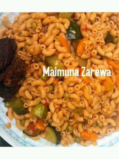 A picture of Macaroni vegetable jollof with grill beef.