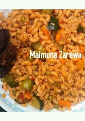 A picture of Macaroni vegetable jollof with grill beef.