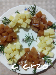Una foto de "Corona" de queso y membrillo