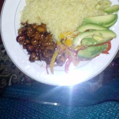 A picture of Rice, mushrooms and avocado.