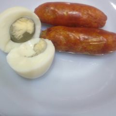 A picture of Boiled, (grilled)sausages and boiled egg.