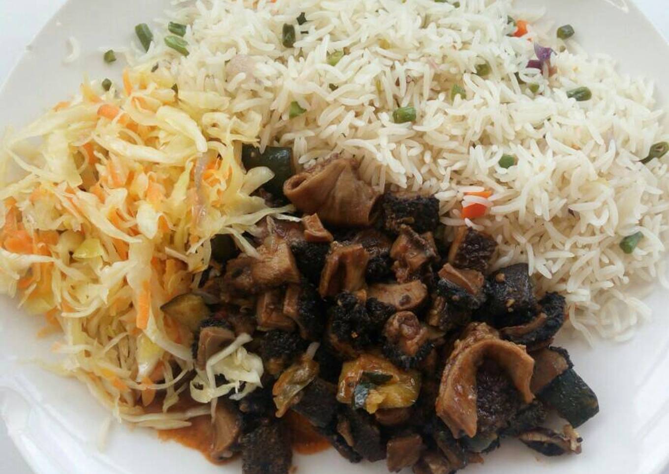 Wet-fried matumbo with rice and cabbages