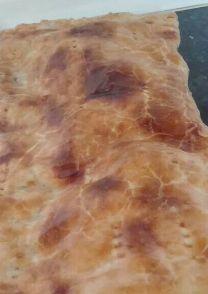 Una foto de Empanada de jamón, calabacín, queso azul y nueces