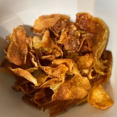 Homemade potato crisps A picture of Homemade potato crisps.