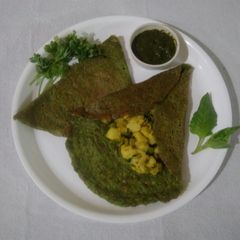 Spinach moong dal chilla with potato bhaji A picture of Spinach moong dal chilla with potato bhaji.