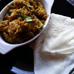 A picture of Neer dosa and Sukka chicken.