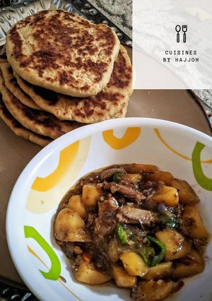 A picture of Naan bread with potatoes sauce.