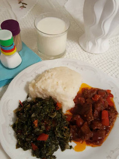 A picture of Ugali,greens and mbuzi fry.