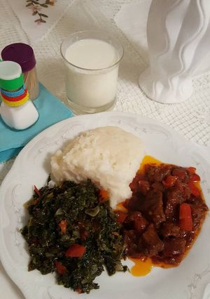 A picture of Ugali,greens and mbuzi fry.