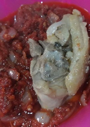 A picture of Tomato stew with chicken.