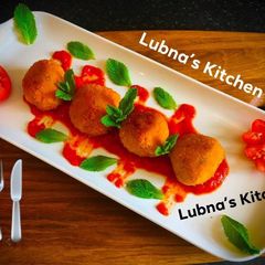 A picture of Aloo Kofta with Spiced Tomato SaucePotato balls with Spiced Tomato Sauce.
