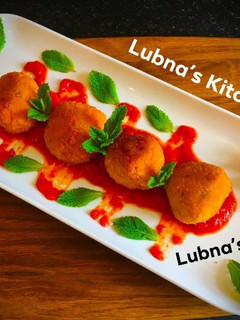 A picture of Aloo Kofta with Spiced Tomato SaucePotato balls with Spiced Tomato Sauce.