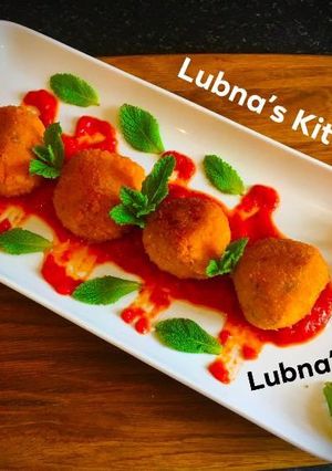 A picture of Aloo Kofta with Spiced Tomato SaucePotato balls with Spiced Tomato Sauce.