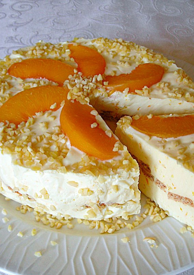 Una foto de Tarta sin horno con queso a la aroma de naranja