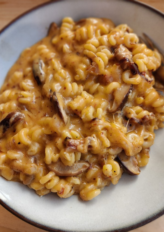 Una foto de Mac&cheese trufa y setas