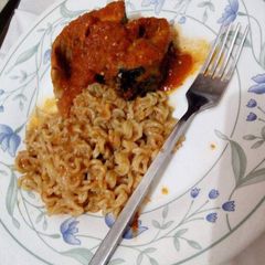 A picture of Half pack of indomine with fish (croaker) stew.