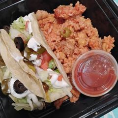 A picture of Beef Tacos and Puerto Rican Rice.