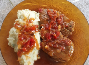 Una foto de Bifes de bondiola a la portuguesa