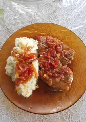 Una foto de Bifes de bondiola a la portuguesa