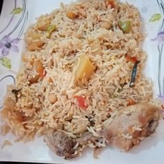 A picture of Chana aloo chicken pulao.