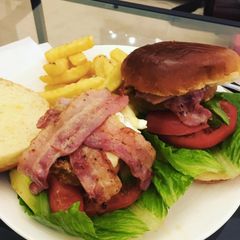 A picture of Pork and Chorizo burger with Brie and Bacon.