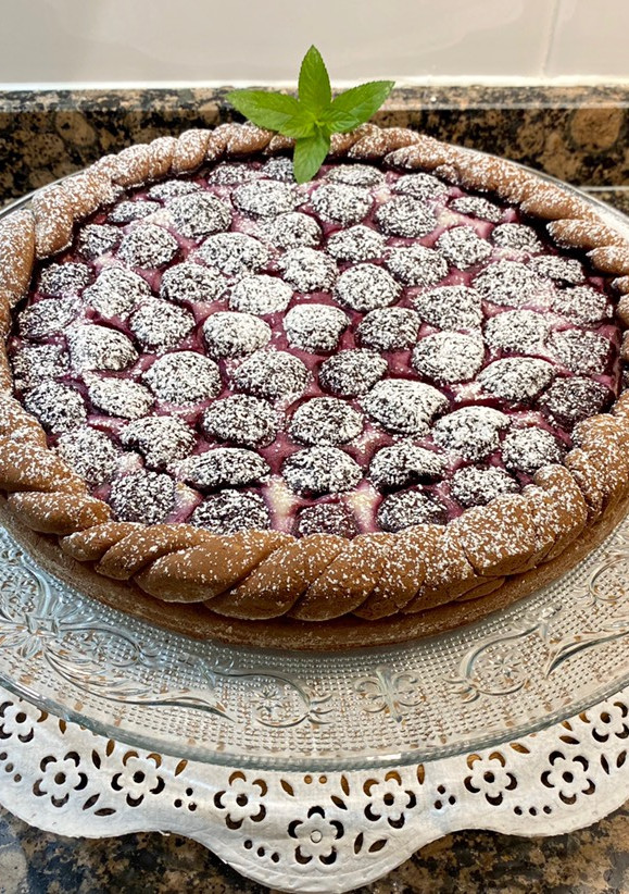 Una foto de Tarta de queso ricotta y cerezas