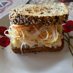 A picture of Toast with eggs and pickled veggie mix (čalamáda).