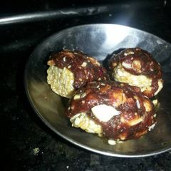 A picture of Dates and seasme rolls.
