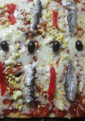 A picture of Oregano Pizza with Sardines and Roasted Peppers.