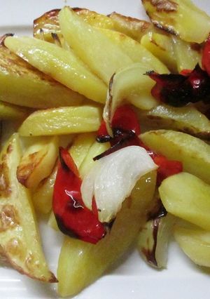 Una foto de Gajos de patatas horneados