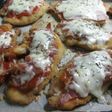 Milanesas con salsa de tomate, jamón y queso.