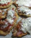 Milanesas con salsa de tomate, jamón y queso.