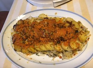 Une photo de Gratin de pommes de terre façon gâteau aux oignons et mimolette vieille