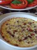 Rodajas de provolone dolce con tomates secados en aceite