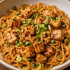 A picture of Peanut noodles with spicy tofu.