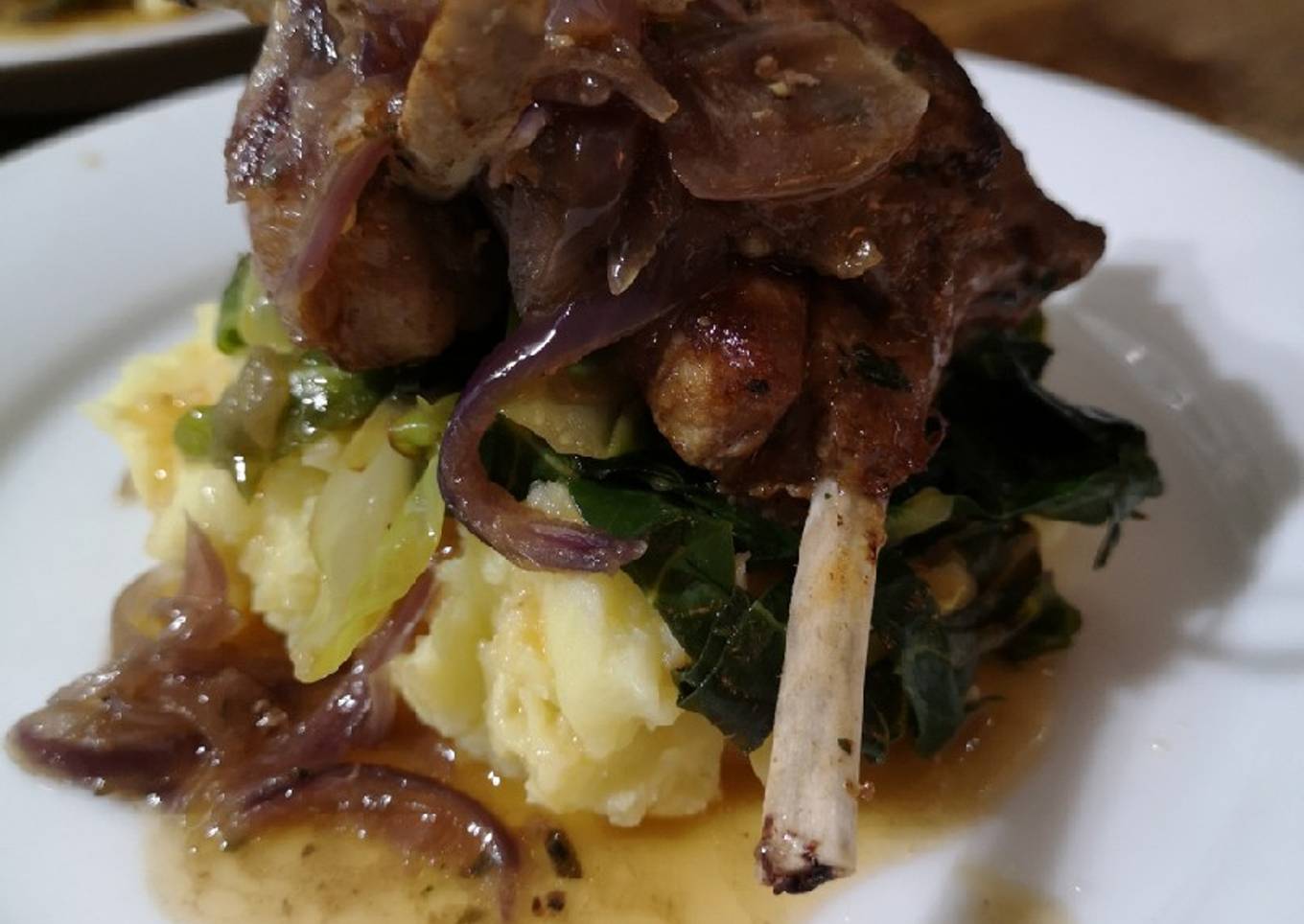 Marinaded lamb cutlets over cabbage and mash