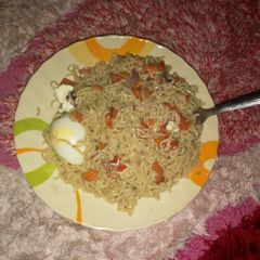 A picture of Indomie n Boiled egg.