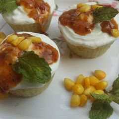 A picture of Idli muffins with Chilli corn sauce.