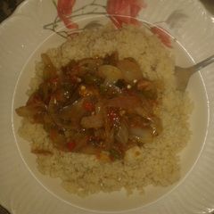 A picture of Couscous with onion sauce.