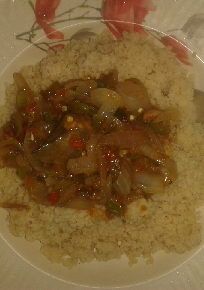 A picture of Couscous with onion sauce.