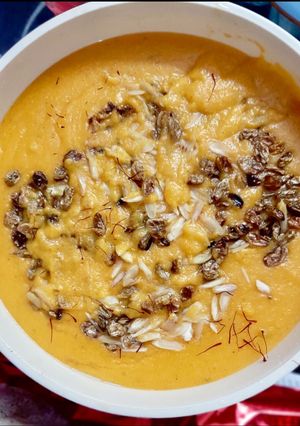 A picture of Semolina saffron kheer with nuts.