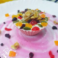A picture of Fruit n Pepper frozen yogurt with peppercorn peanut crunch.