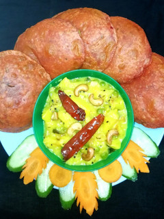 A picture of Beetroot Puri with potato bhaji.