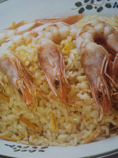 Una foto de Risotto a la naranja con langostinos