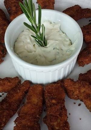 Una foto de Pollo con romero y parmesano
