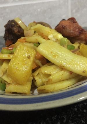 A picture of Homade Macaroni with Irish jollof & peppered chicken.