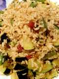 Salteado de arroz integral con calabacín, judías verdes y jamón ibérico