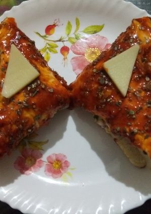 A picture of Schezwan cheese club sandwich.