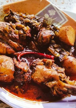 A picture of Tamarind chicken curry with potatoes.