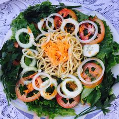A picture of Low fat pasta on green salad.
